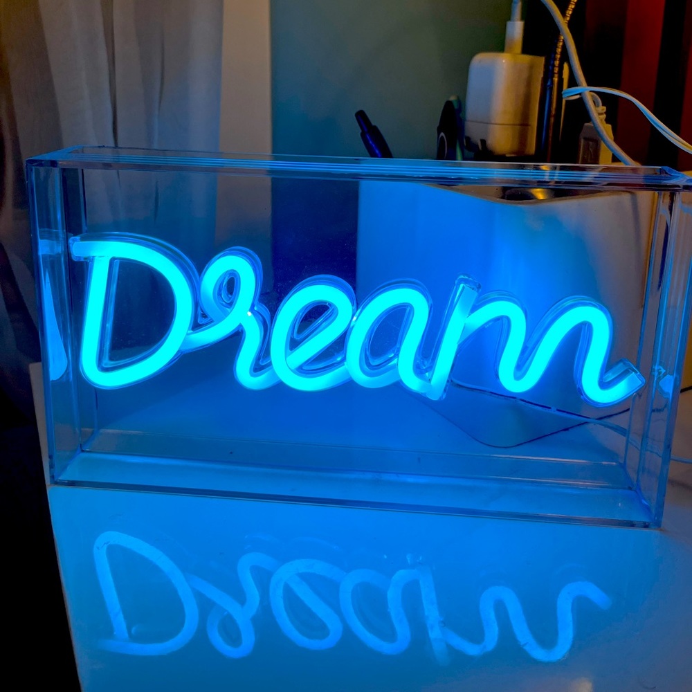 Blue fluorescent “dream” sign, room decor
